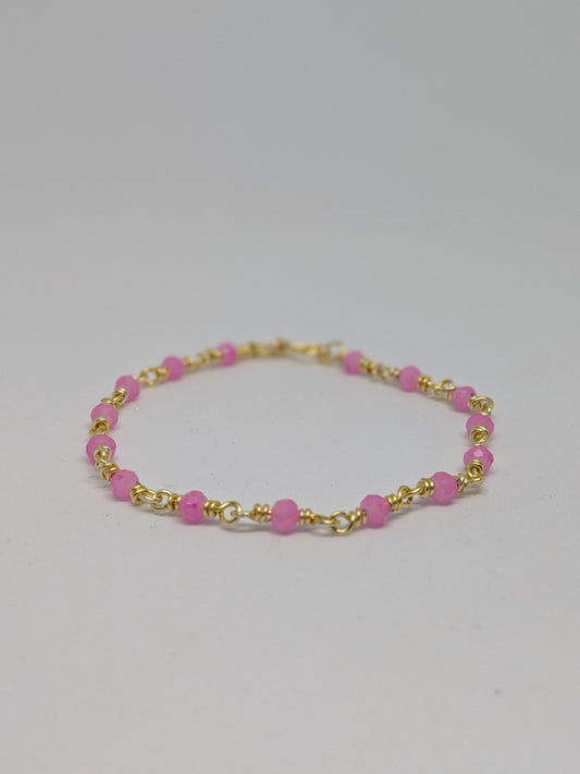 Elegantes Glieder-Armband in Hellgold mit geschliffenen pinken Glasperlen