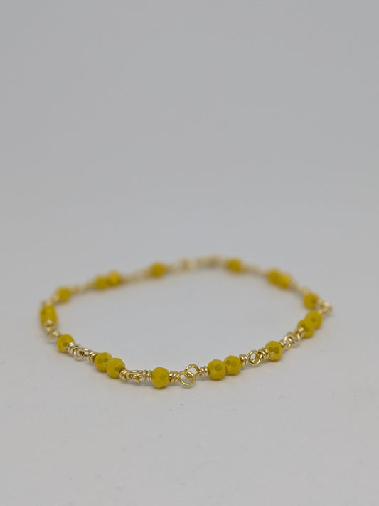 Elegantes Glieder-Armband in Hellgold mit geschliffenen gelben Glasperlen